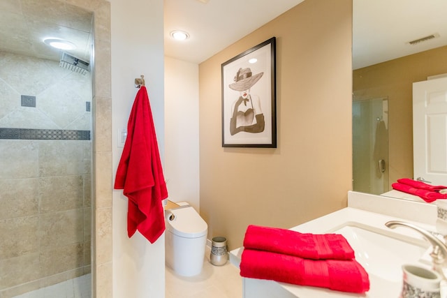 bathroom featuring vanity, an enclosed shower, and toilet