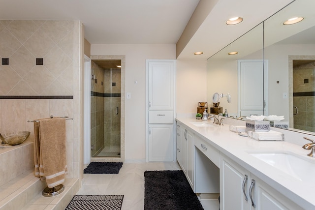 bathroom with vanity and an enclosed shower