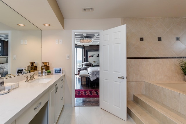 bathroom with vanity and tile patterned floors