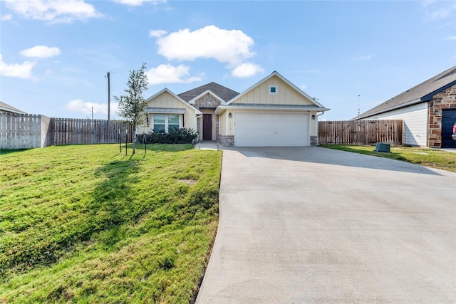 ranch-style house featuring a garage and a front lawn