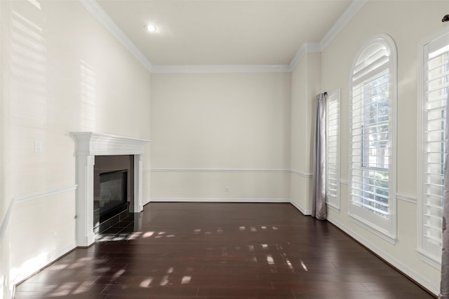 unfurnished living room featuring crown molding and dark hardwood / wood-style floors