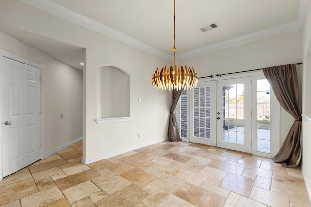 unfurnished dining area with a notable chandelier, crown molding, and french doors