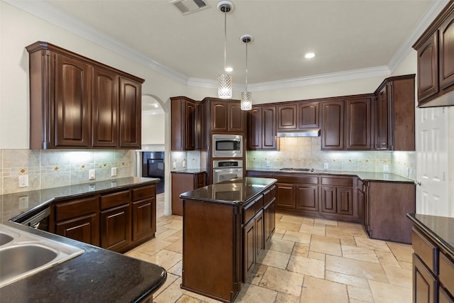 kitchen featuring dark brown cabinets, appliances with stainless steel finishes, and a kitchen island