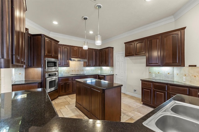 kitchen featuring appliances with stainless steel finishes, sink, and dark brown cabinets