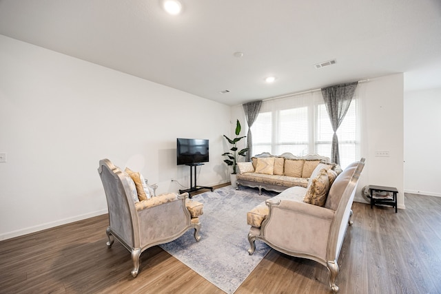 living room with dark hardwood / wood-style flooring