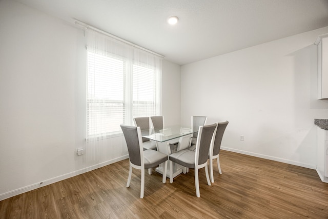 dining room featuring light hardwood / wood-style flooring