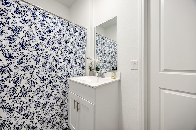 bathroom featuring vanity and walk in shower