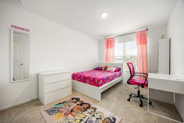 bedroom featuring light colored carpet