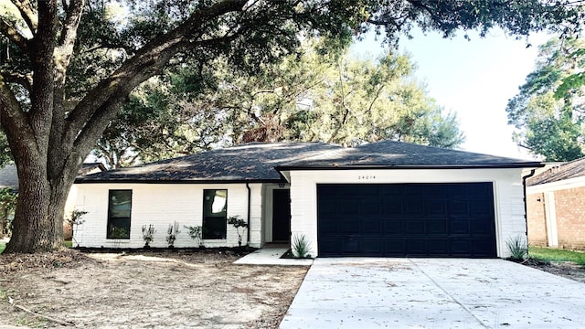 single story home with a garage