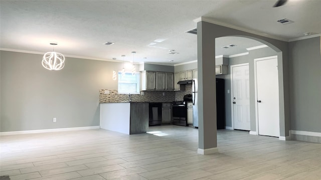 kitchen with crown molding, light hardwood / wood-style flooring, stainless steel range oven, and decorative backsplash