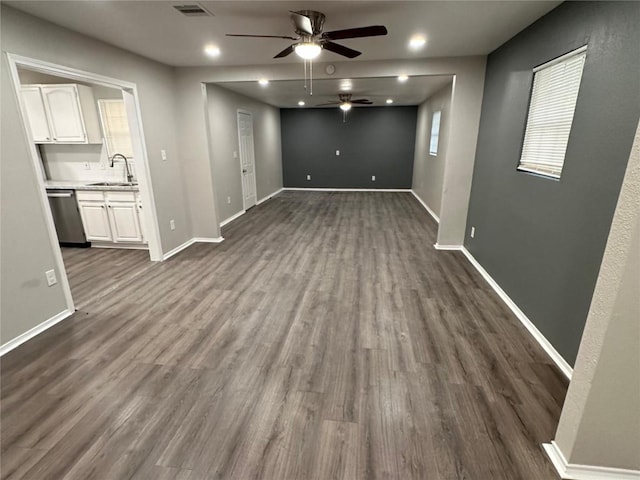 interior space with dark wood-type flooring, ceiling fan, and sink