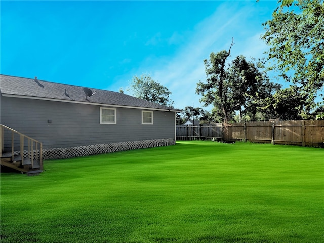 view of yard with fence