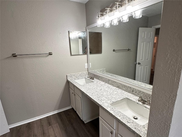 bathroom with vanity and hardwood / wood-style floors