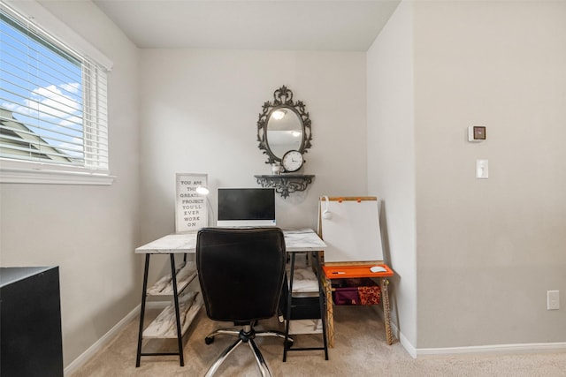 home office with baseboards and carpet floors