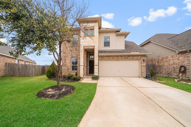 view of front facade featuring a garage and a front yard