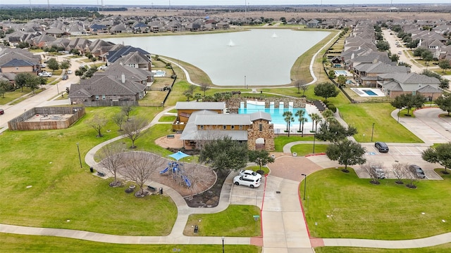 bird's eye view with a residential view and a water view