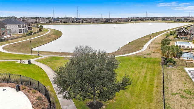 birds eye view of property featuring a residential view and a water view