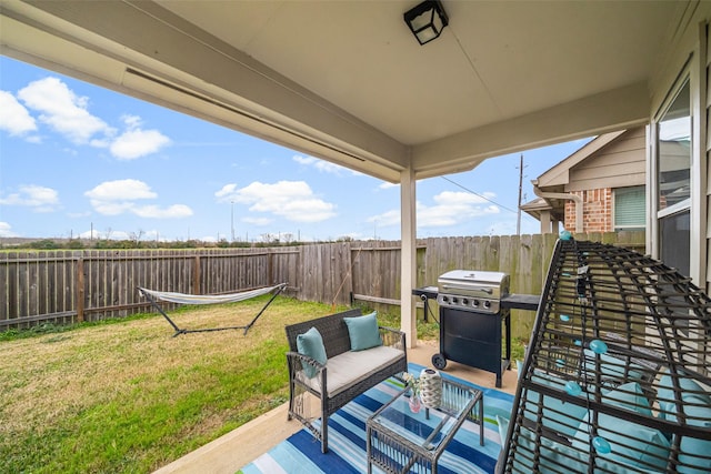 view of patio / terrace with an outdoor living space, a fenced backyard, and a grill