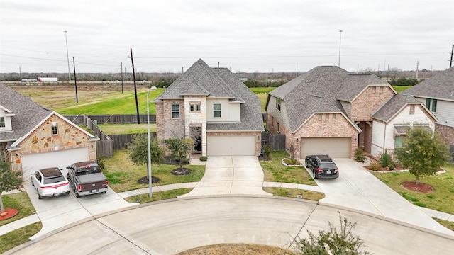 view of front of home featuring a front yard, a garage, stone siding, and roof with shingles