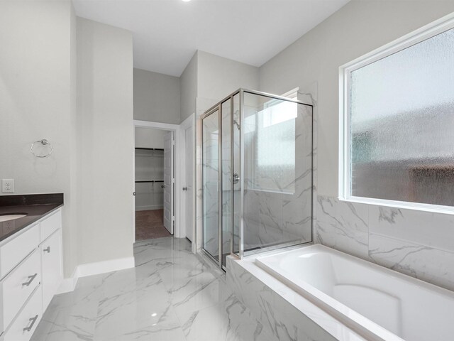 29651 Bur Creek Ln, Fulshear, TX 77441 - full bathroom with a marble finish shower, a garden tub, vanity, and baseboards