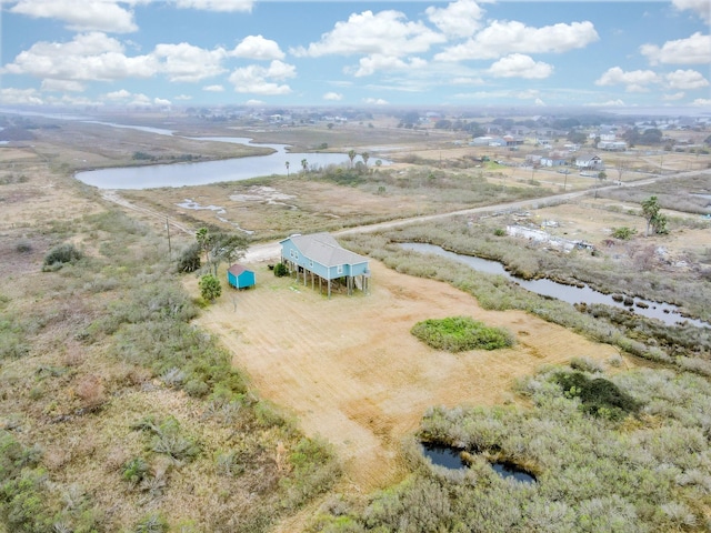 birds eye view of property featuring a rural view and a water view