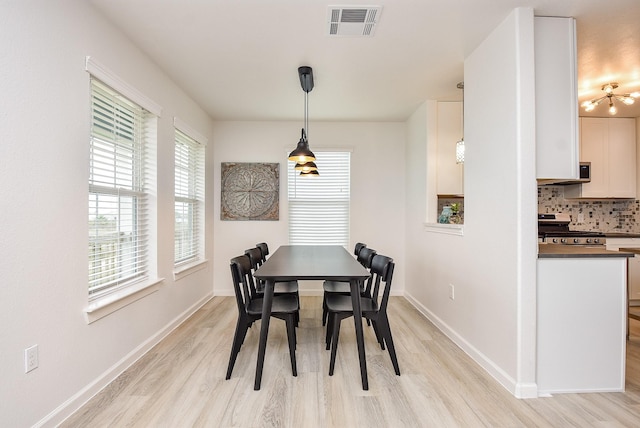 dining room with light hardwood / wood-style flooring