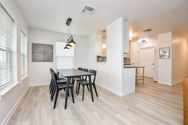 dining room featuring light hardwood / wood-style floors