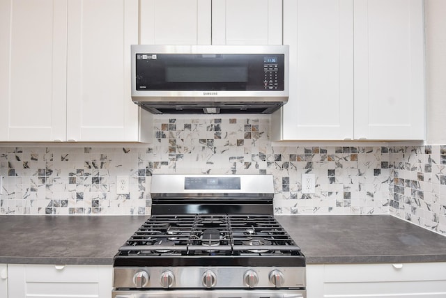 kitchen with tasteful backsplash, stainless steel appliances, and white cabinets