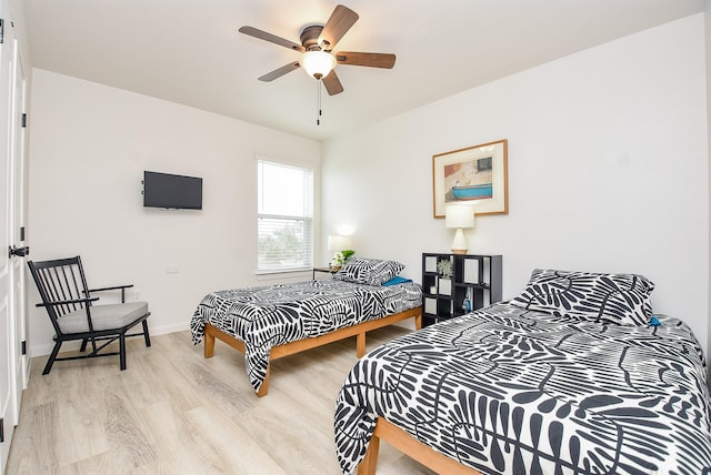 bedroom featuring ceiling fan and light hardwood / wood-style floors