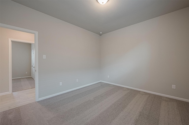 empty room featuring light carpet