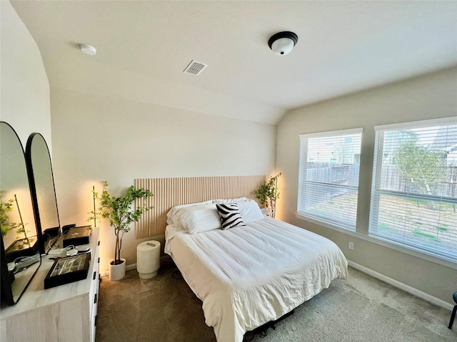 carpeted bedroom featuring vaulted ceiling