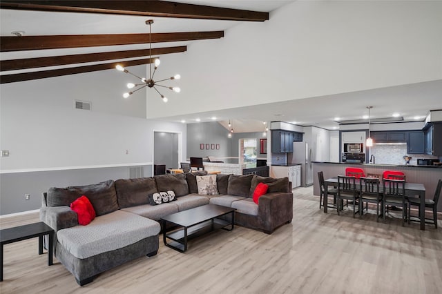 living room featuring a notable chandelier, beam ceiling, high vaulted ceiling, and light wood-type flooring