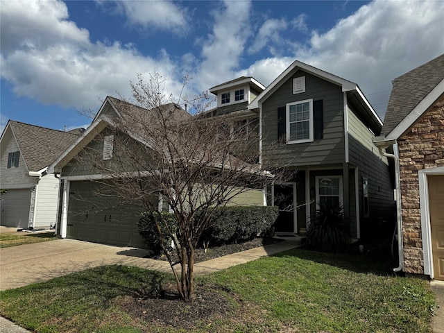 front of property featuring a garage and a front lawn