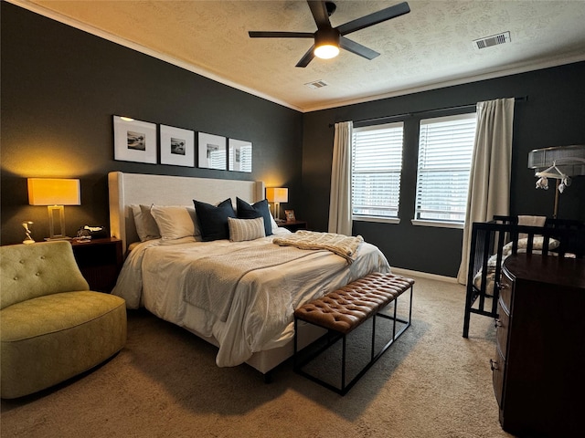 bedroom with light carpet, ceiling fan, ornamental molding, and a textured ceiling