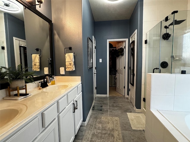 bathroom with vanity, plus walk in shower, and tile patterned flooring