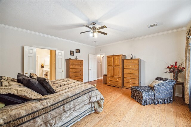 bedroom featuring crown molding, ceiling fan, ensuite bathroom, and light hardwood / wood-style floors