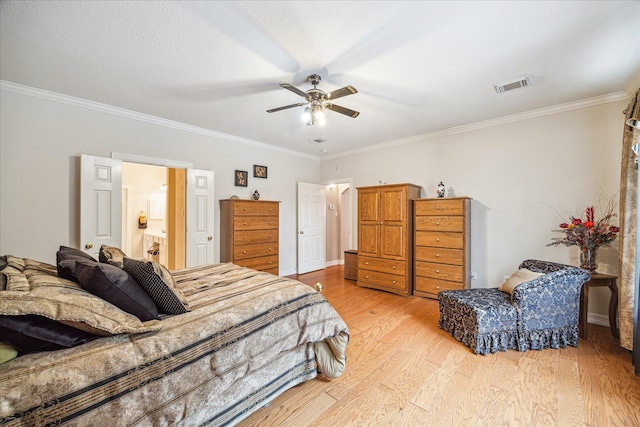 bedroom with ceiling fan, light hardwood / wood-style floors, crown molding, and ensuite bathroom