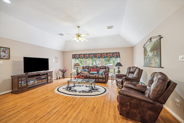 living room with hardwood / wood-style floors, vaulted ceiling, and ceiling fan