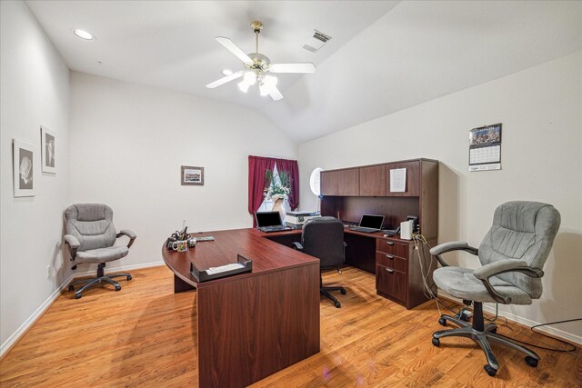 office area with light hardwood / wood-style flooring, ceiling fan, and vaulted ceiling