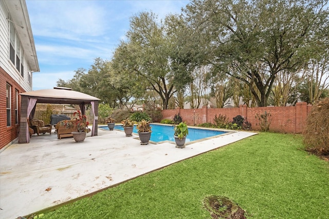 view of pool featuring a yard, a gazebo, and a patio area