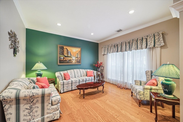 living room with ornamental molding and wood-type flooring