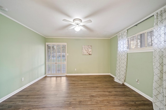 spare room with ceiling fan, ornamental molding, and dark hardwood / wood-style floors