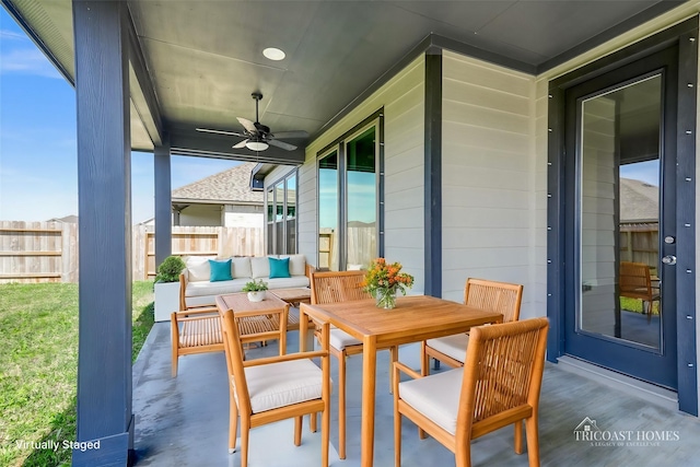 view of patio featuring ceiling fan, outdoor lounge area, and fence