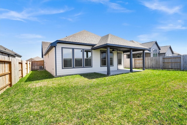 back of property featuring a yard, cooling unit, a fenced backyard, and a patio area