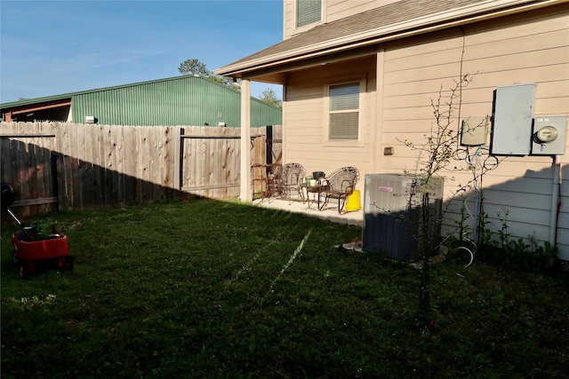 view of yard featuring central air condition unit