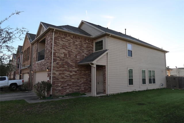 view of front facade with a garage and a front lawn