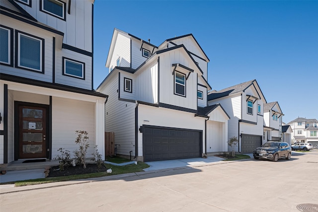 view of front facade with a garage, a residential view, board and batten siding, and concrete driveway