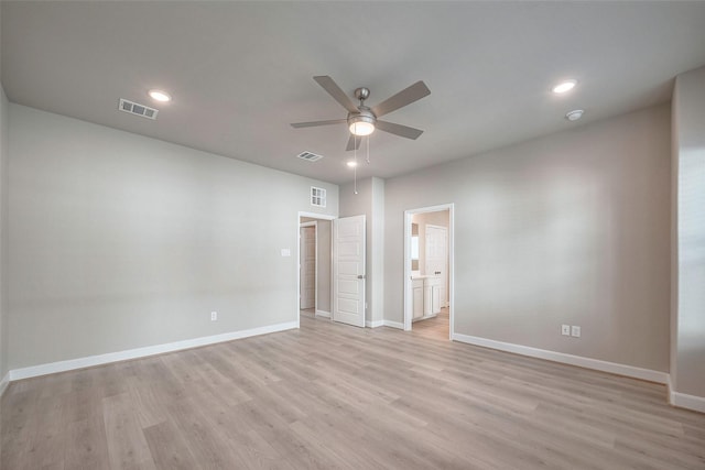 unfurnished bedroom featuring light wood-style flooring, visible vents, and baseboards