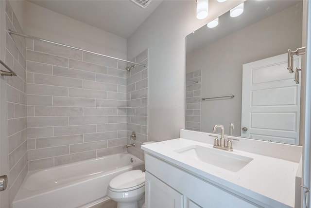 bathroom with visible vents, vanity, shower / tub combination, and toilet