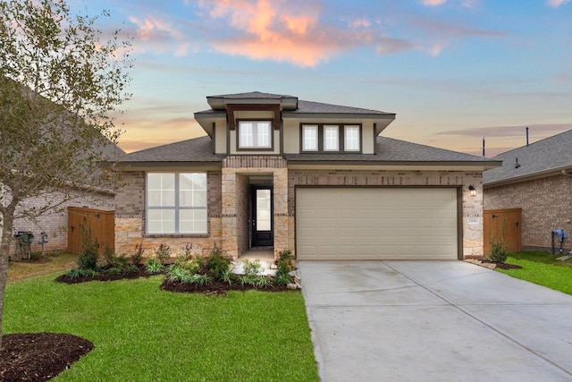 prairie-style home featuring a lawn